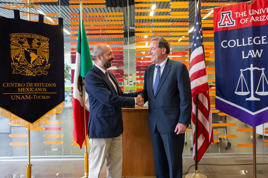 Salazar and Miller Hand Shake Photo.jpg
